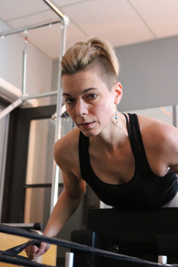 Meet Julie the Pilates teacher. Julie teachers Pilates Reformer.